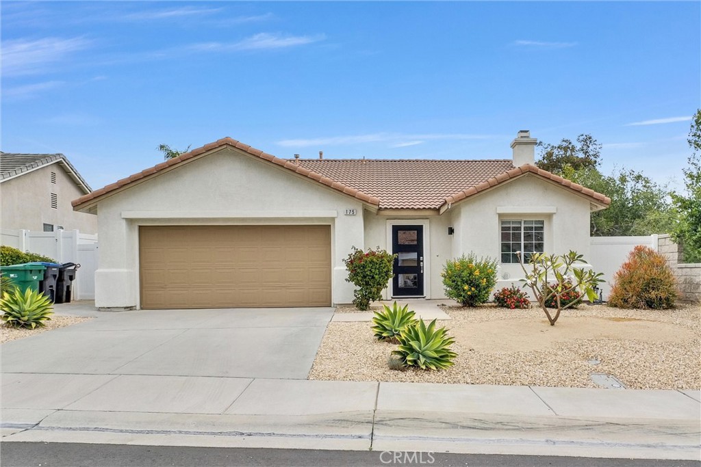 175 Paperbirch Circle Corona, CA 92881 - Photo 1 of 28 a front view of a house with a yard