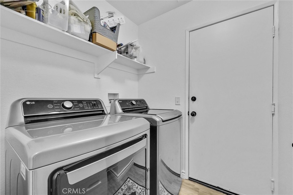 175 Paperbirch Circle Corona, CA 92881 - Photo 12 of 28 a utility room with dryer and washer