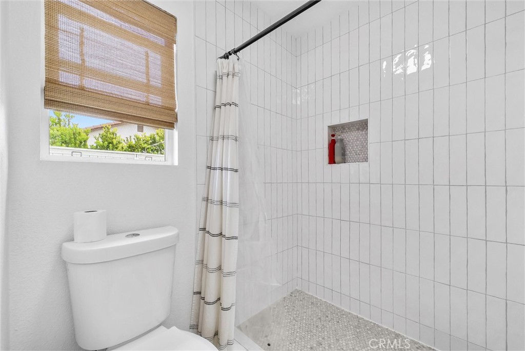 175 Paperbirch Circle Corona, CA 92881 - Photo 17 of 28 a bathroom with a toilet and shower