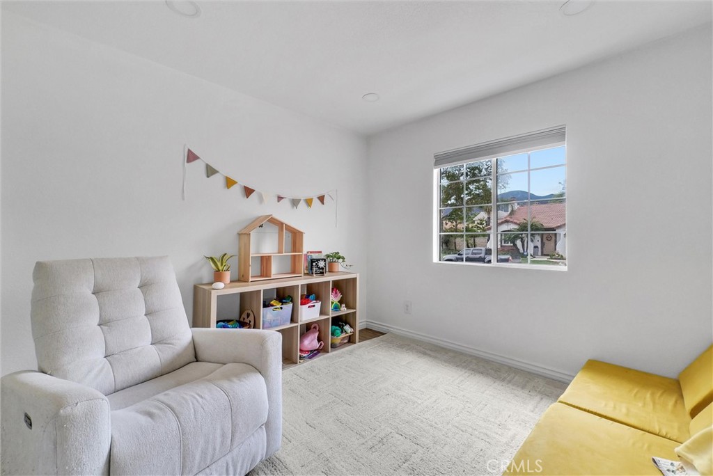 175 Paperbirch Circle Corona, CA 92881 - Photo 20 of 28 a bedroom with furniture and a baby crib
