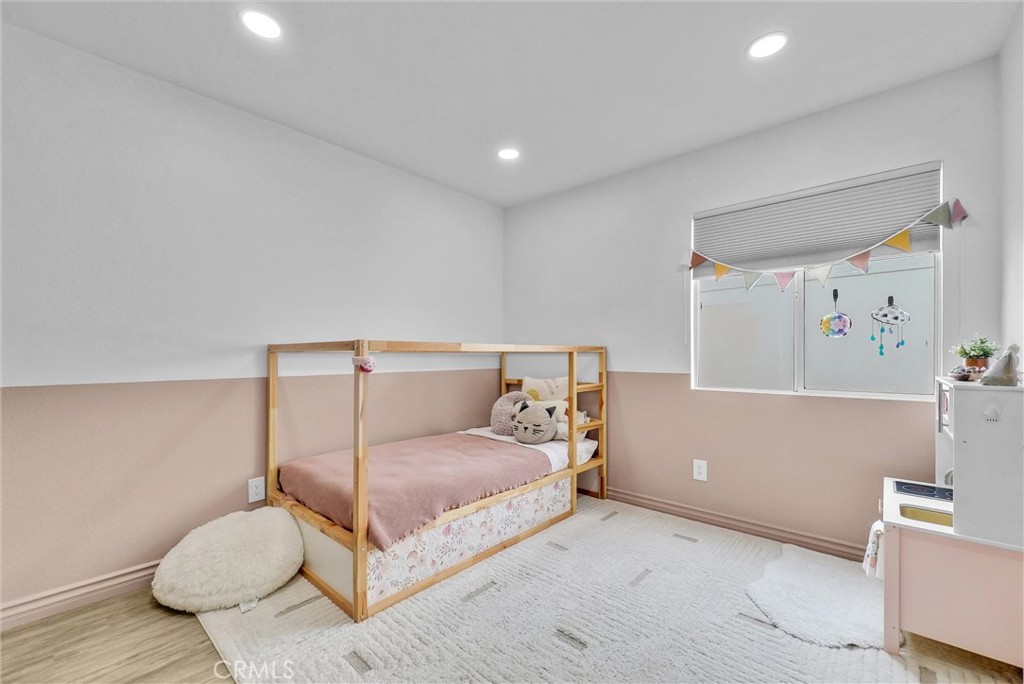 175 Paperbirch Circle Corona, CA 92881 - Photo 3 of 28 a bedroom with a bed and a couch
