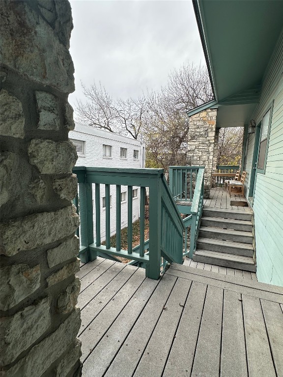 a view of a balcony with wooden floor