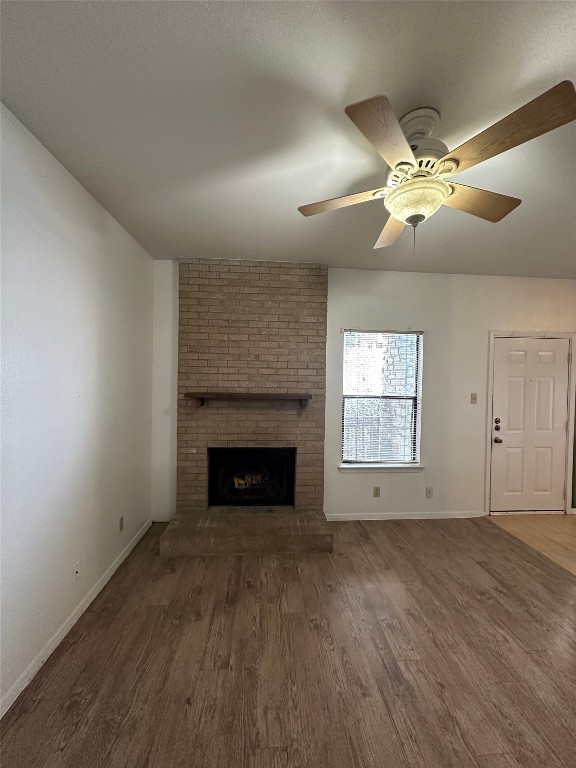 2813 1/2 Rio Grande Street, Unit 7 Austin, TX 78701 - Photo 5 of 11 a view of empty room with wooden floor and fan