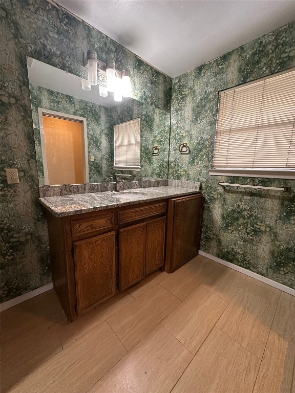 2813 1/2 Rio Grande Street, Unit 7 Austin, TX 78701 - Photo 10 of 11 a bathroom with a sink and a mirror