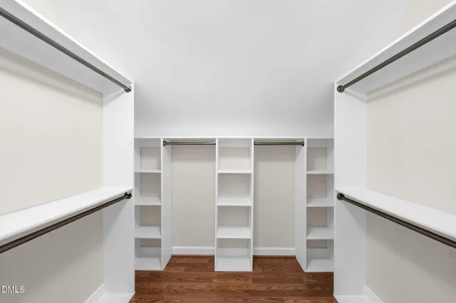 a backyard of a house with barbeque oven and outdoor seating