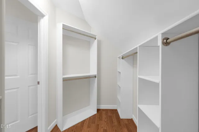 a view of a field with trees in the background