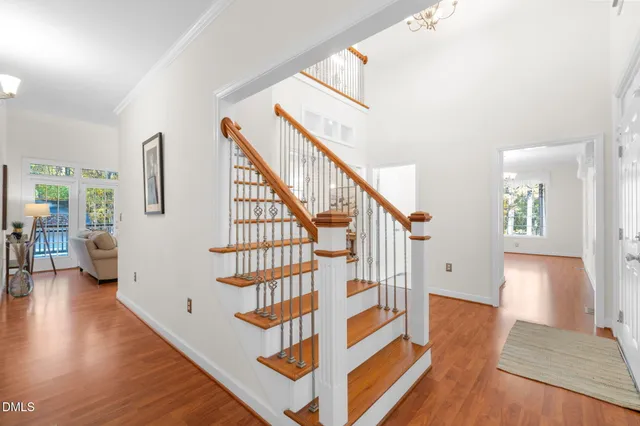 a living room with furniture large window and a fireplace