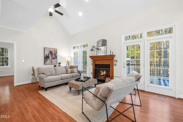 a kitchen with granite countertop white cabinets and stainless steel appliances