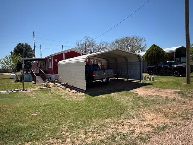 310 County Road KC Childress, TX 79201 - Photo 11 of 25 a view of a backyard with sitting area