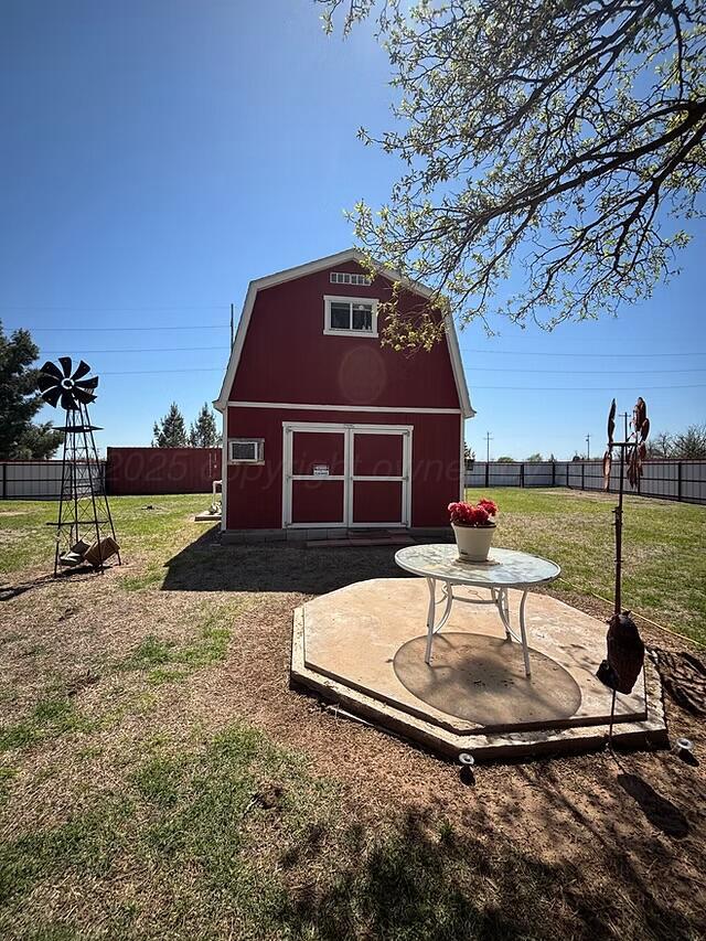 310 County Road KC Childress, TX 79201 - Photo 13 of 25 a table and chairs in front of a house