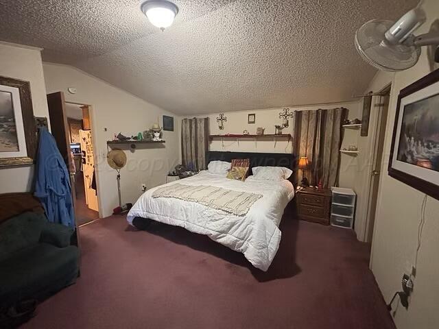 310 County Road KC Childress, TX 79201 - Photo 19 of 25 a bedroom with a bed and a flat tv screen on the dresser