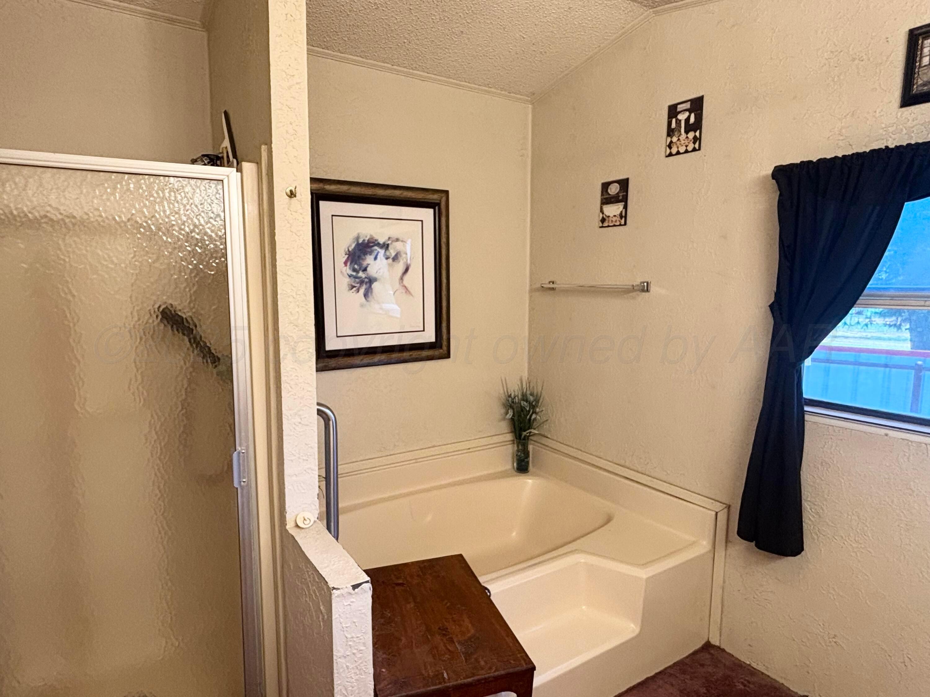 310 County Road KC Childress, TX 79201 - Photo 20 of 25 a bathroom with a sink and a shower
