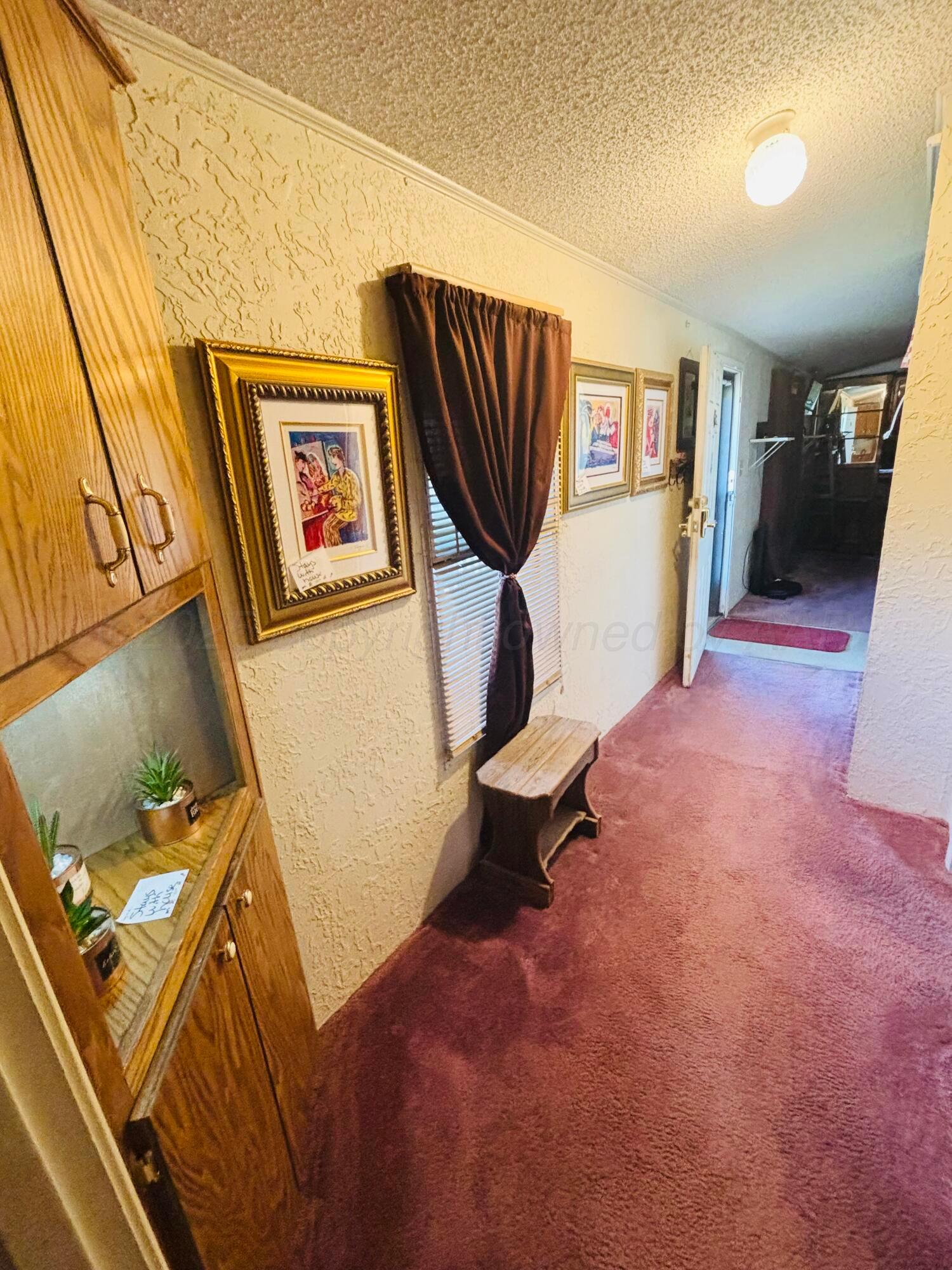 310 County Road KC Childress, TX 79201 - Photo 21 of 25 a living room with furniture and a flat screen tv