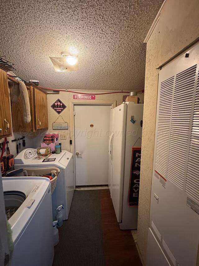 310 County Road KC Childress, TX 79201 - Photo 24 of 25 a view of storage and utility room with refrigerator and washer