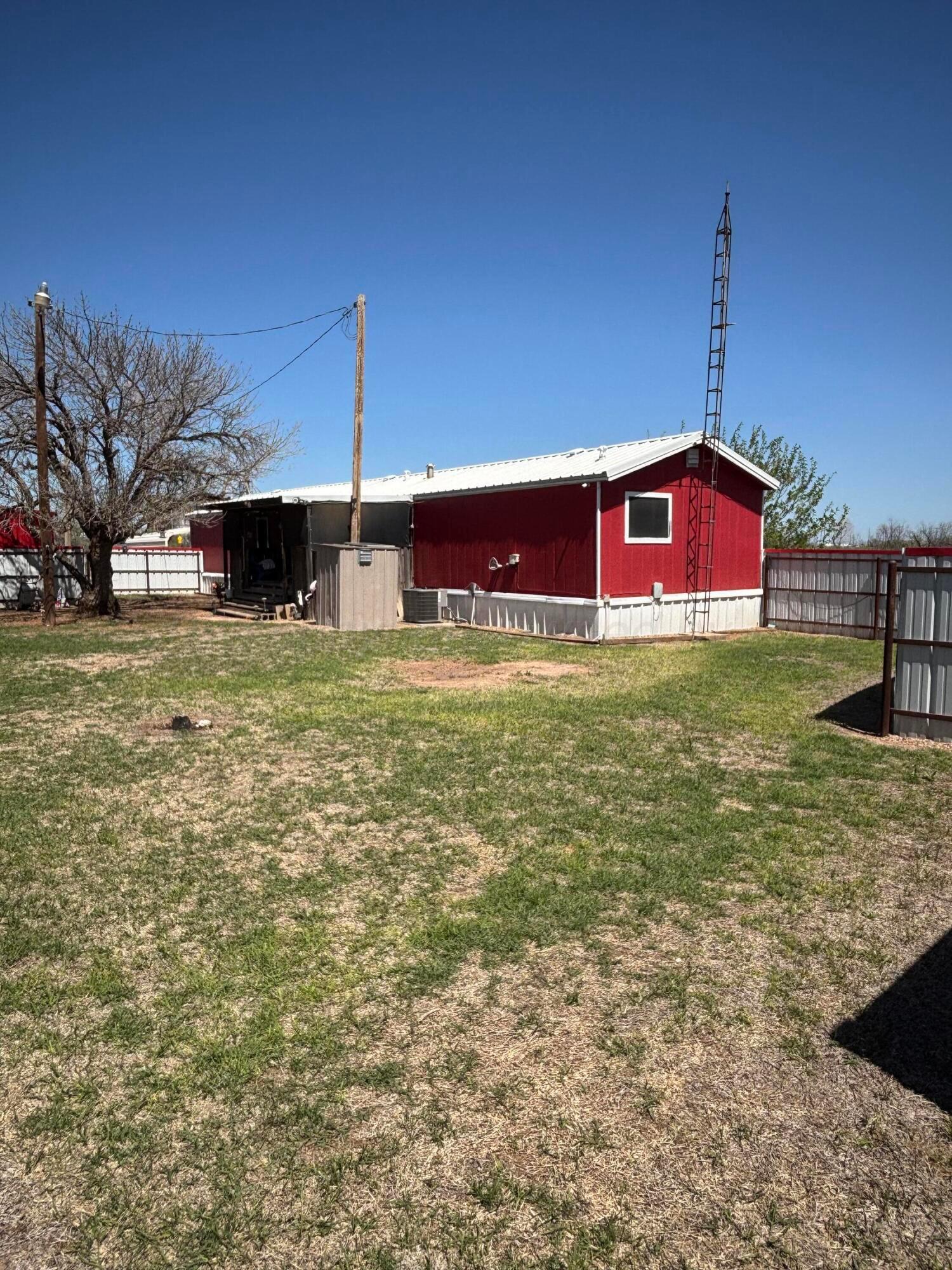 310 County Road KC Childress, TX 79201 - Photo 4 of 25 a view of a house with a yard