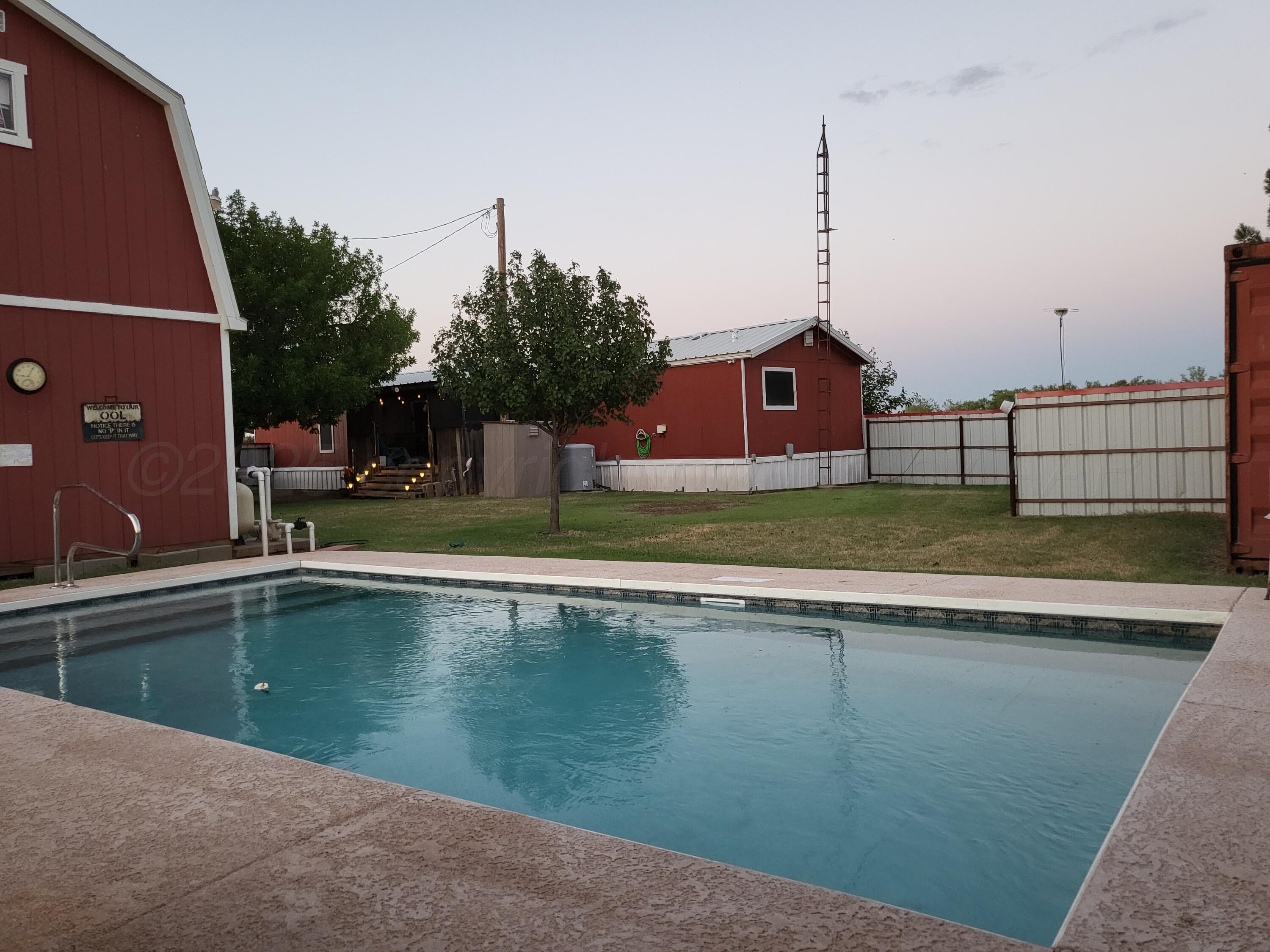 310 County Road KC Childress, TX 79201 - Photo 5 of 25 a view of a house with a swimming pool