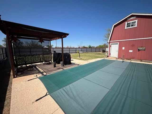 a view of a house with a swimming pool