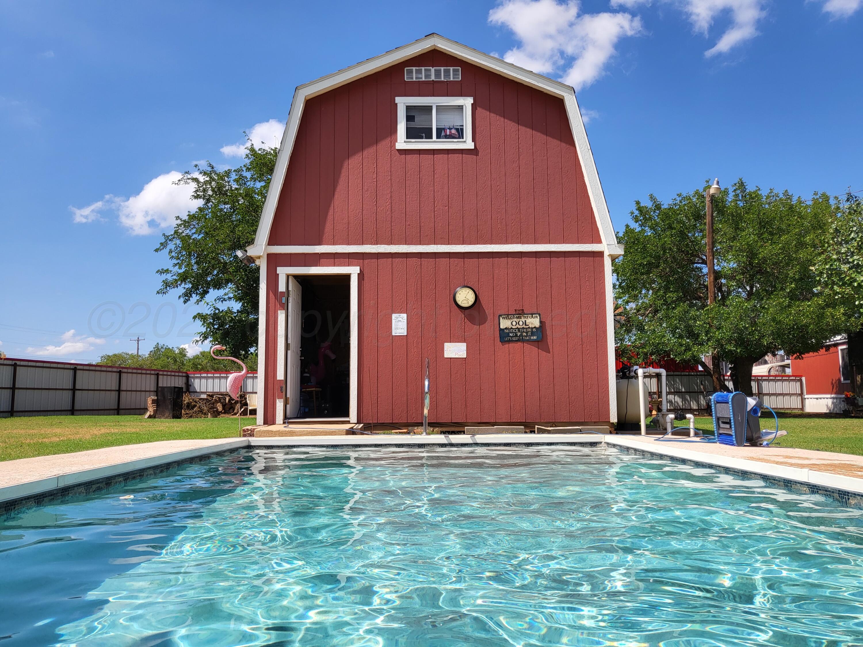 310 County Road KC Childress, TX 79201 - Photo 7 of 25 a view of a house with a swimming pool