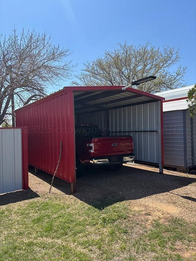 310 County Road KC Childress, TX 79201 - Photo 10 of 25 a view of backyard with wooden fence and trees