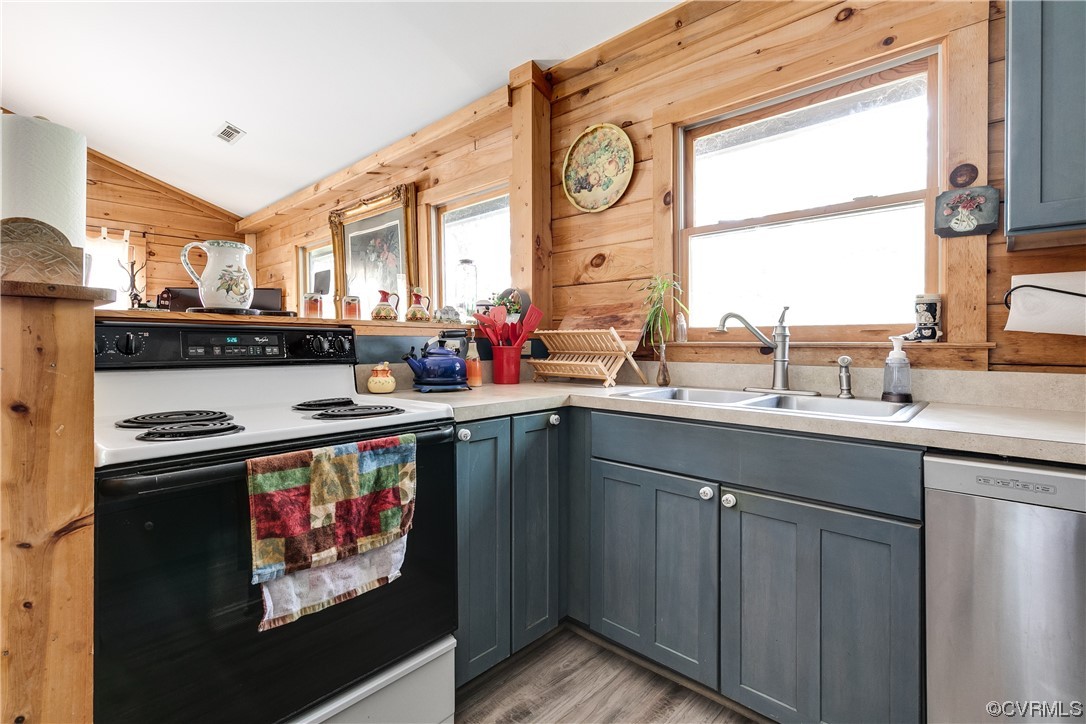 4895 Old Fredericksburg Road Mineral, VA 23117 - Photo 14 of 39 a kitchen with stainless steel appliances a sink stove and cabinets