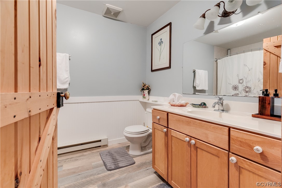 4895 Old Fredericksburg Road Mineral, VA 23117 - Photo 17 of 39 a bathroom with a granite countertop toilet sink and mirror