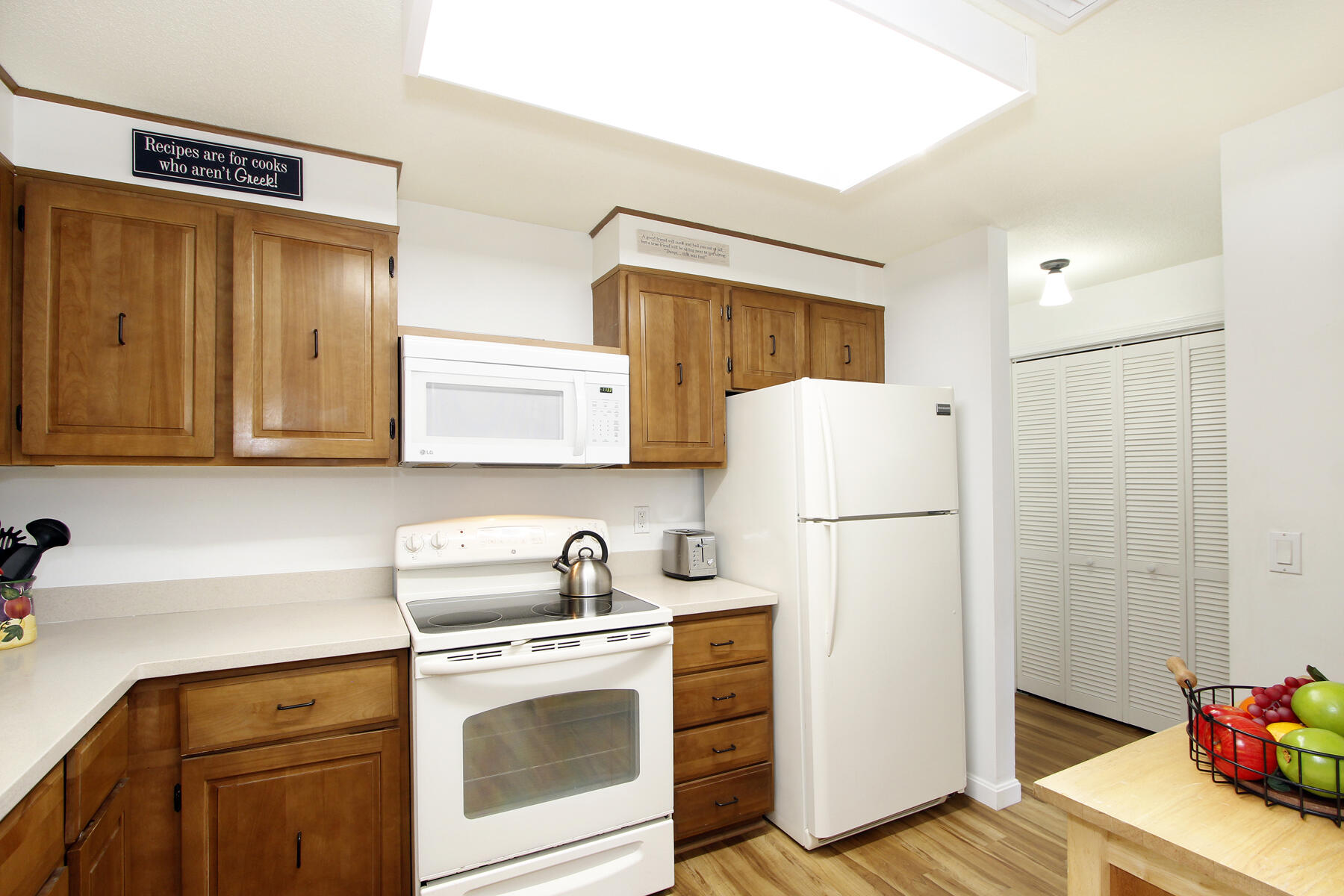 42 Old Colony Way, Unit 6 Orleans, MA 02653 - Photo 11 of 22 a kitchen with a refrigerator sink stove and cabinets