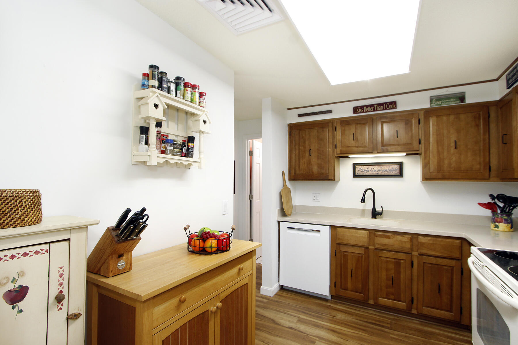 42 Old Colony Way, Unit 6 Orleans, MA 02653 - Photo 12 of 22 a kitchen with a sink cabinets and wooden floor