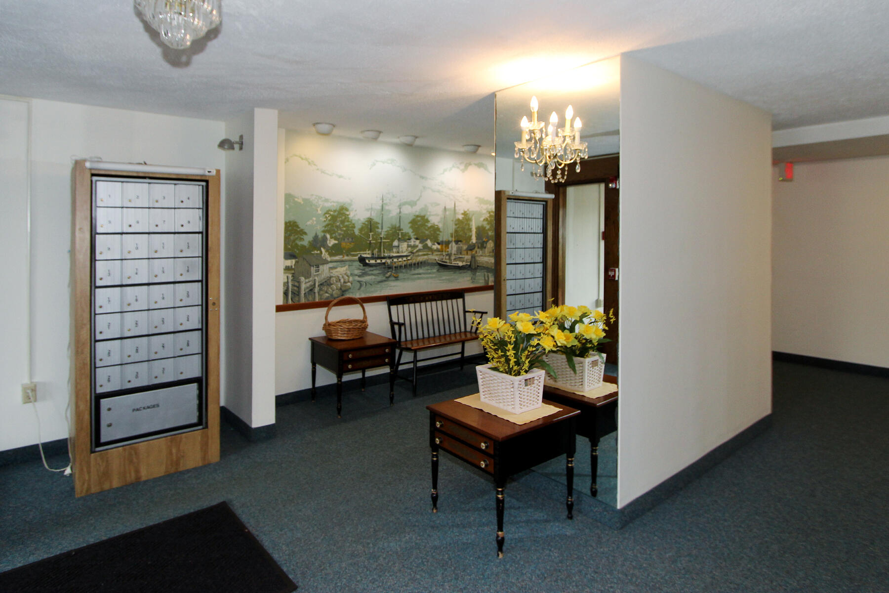 42 Old Colony Way, Unit 6 Orleans, MA 02653 - Photo 19 of 22 a living room with furniture and a chandelier