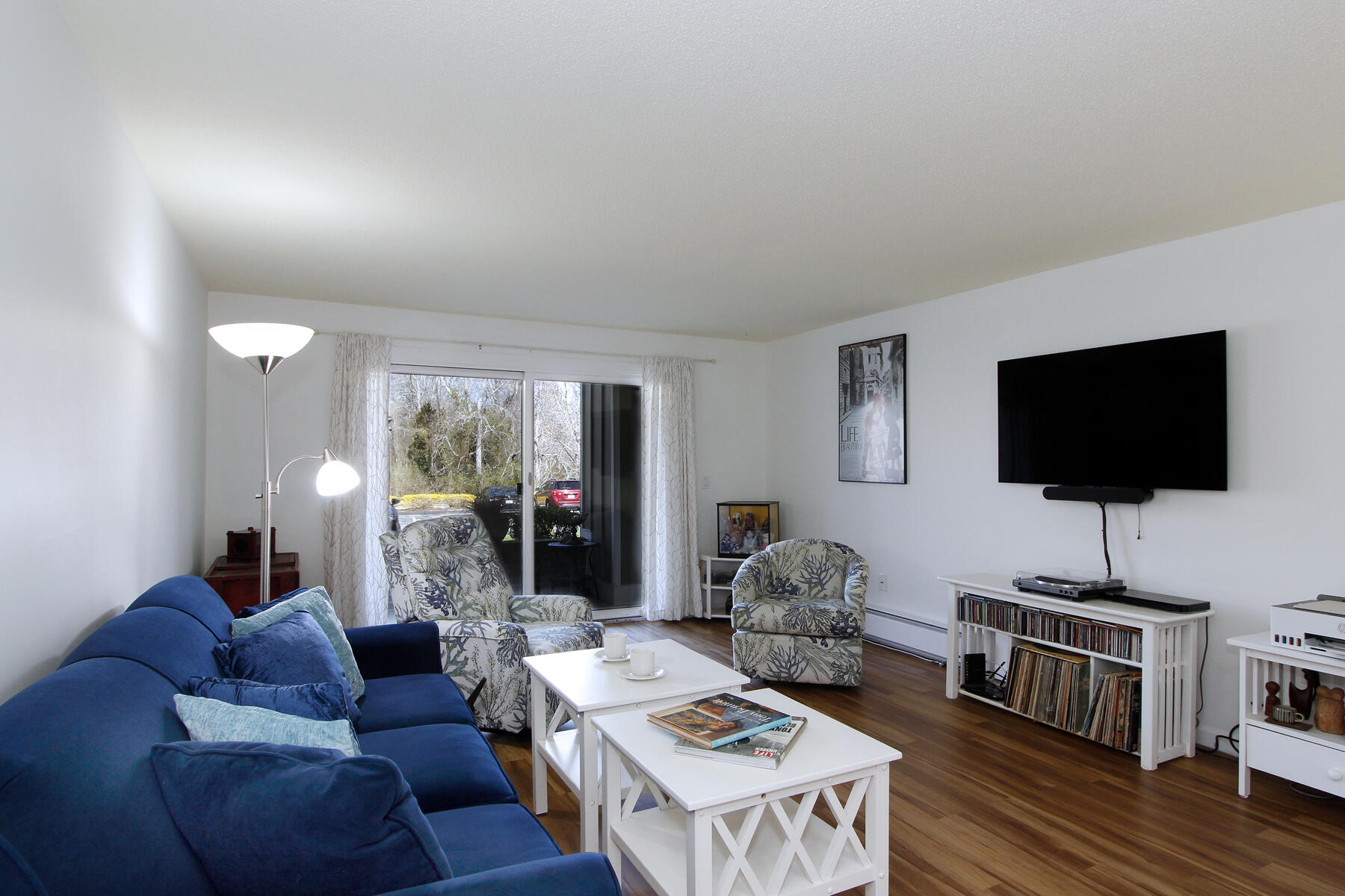 42 Old Colony Way, Unit 6 Orleans, MA 02653 - Photo 5 of 22 a living room with furniture and a flat screen tv