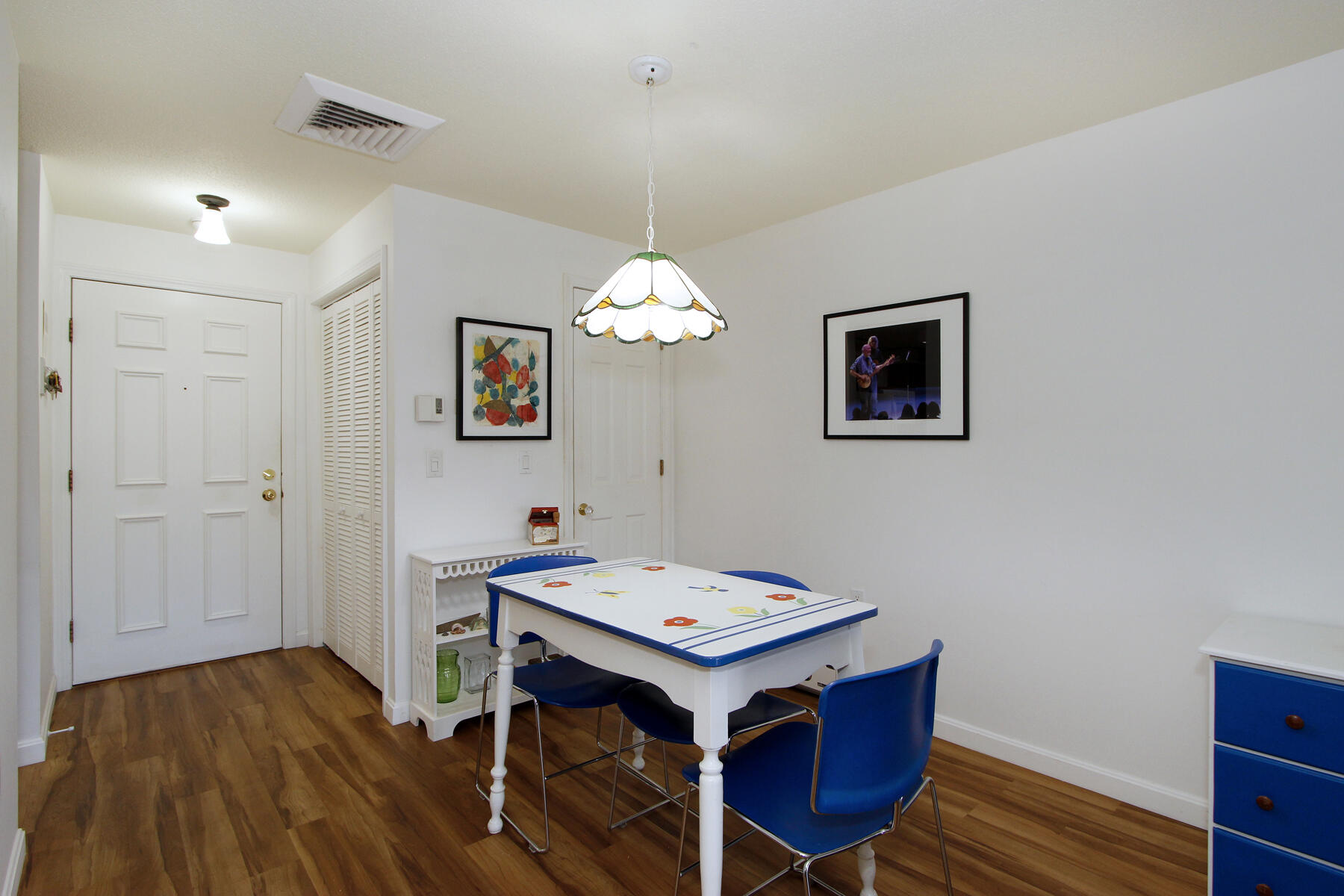 42 Old Colony Way, Unit 6 Orleans, MA 02653 - Photo 9 of 22 a view of a dining room with furniture wooden floor and a chandelier