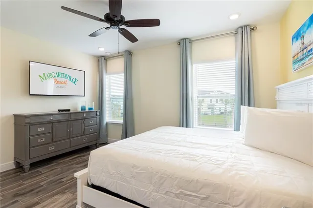 a bedroom with a bed dresser and a window