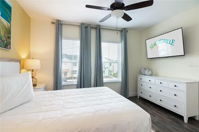 a bedroom with a bed and a dresser