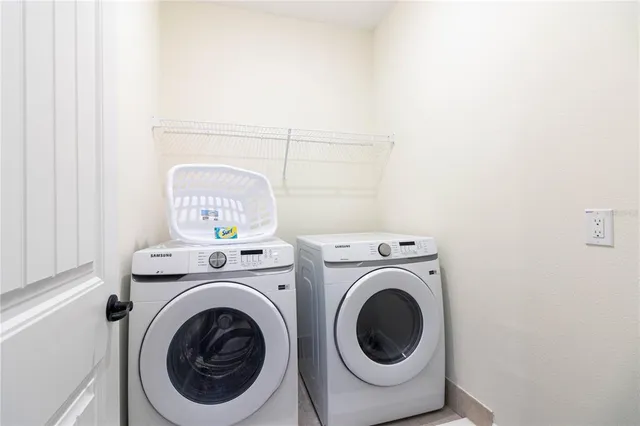a utility room with dryer and washer