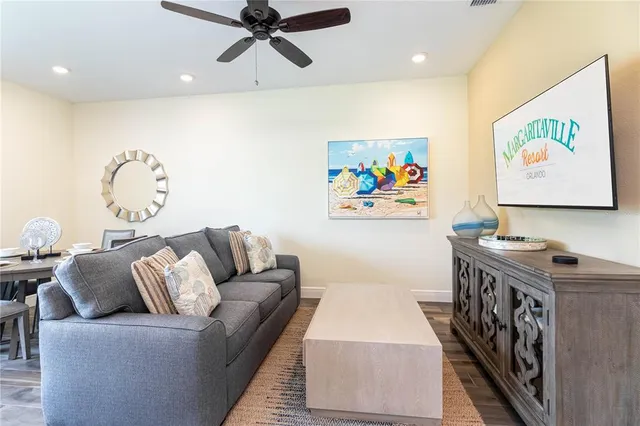 a living room with furniture and a rug