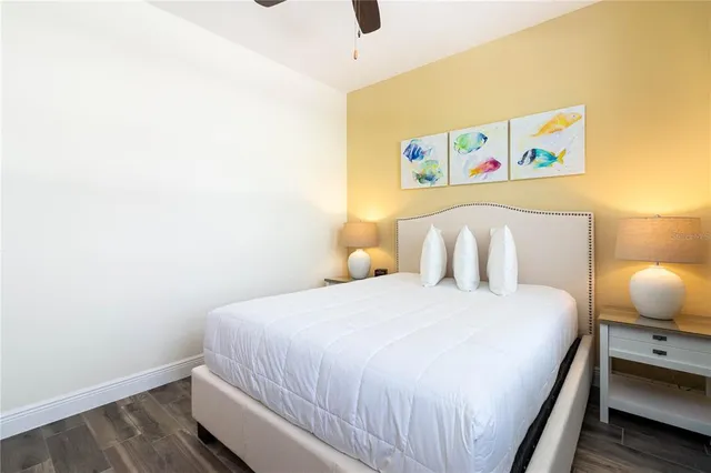 a bedroom with a bed and lamp