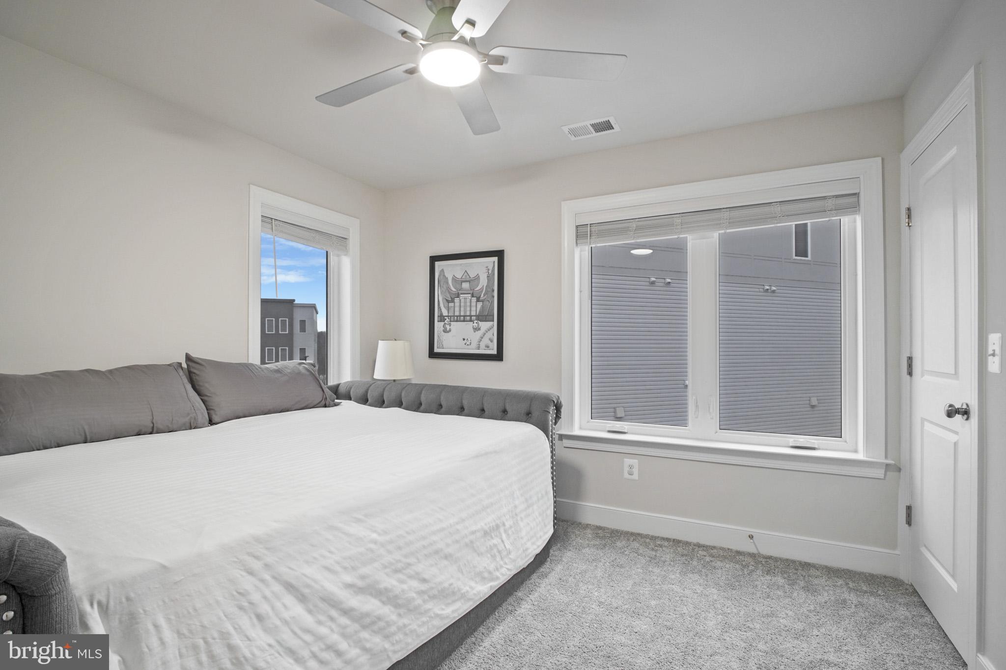 15535 Smoke Woodbridge, VA 22191 - Photo 23 of 44 a bedroom with a large bed and a chandelier