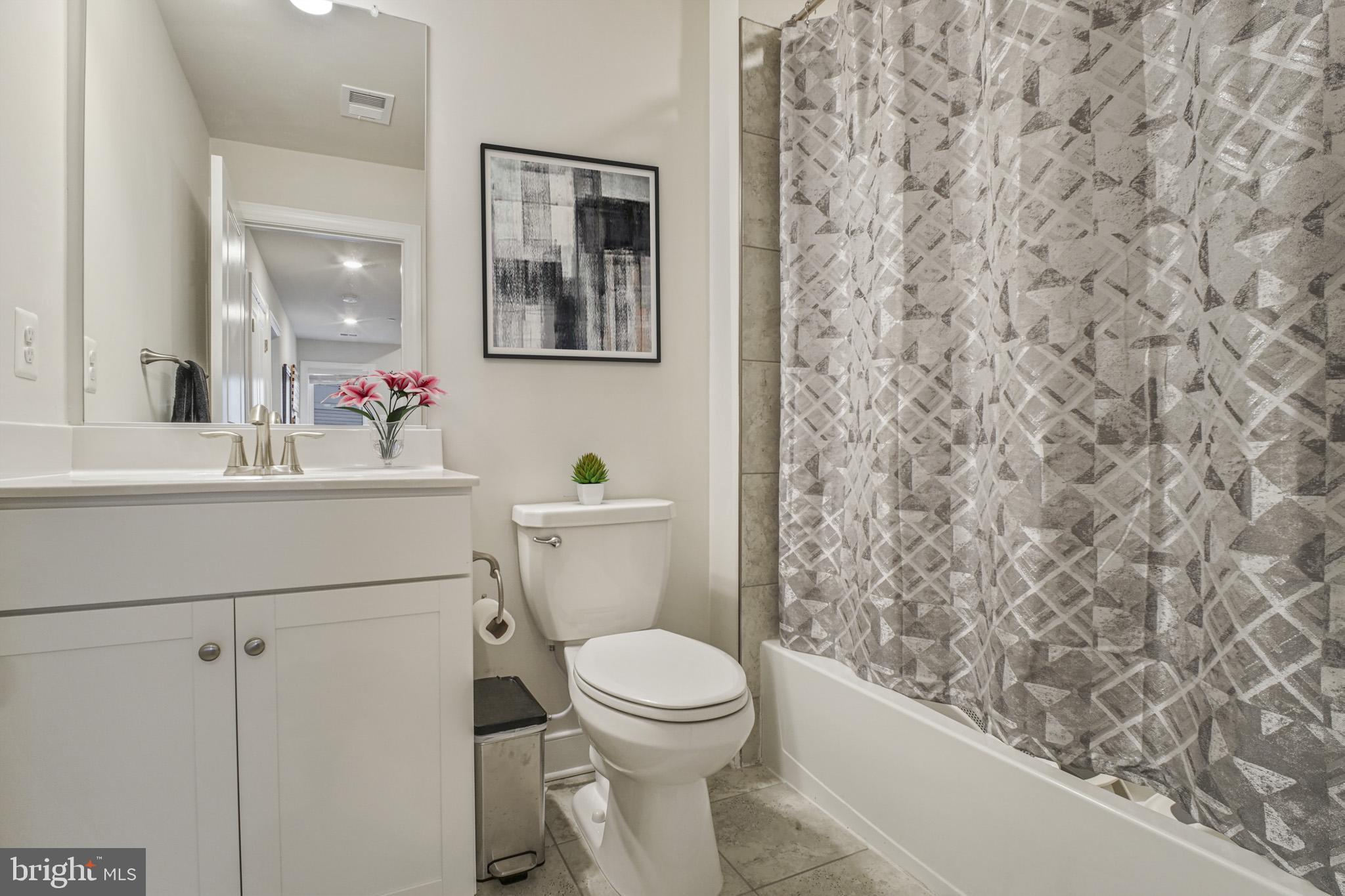 15535 Smoke Woodbridge, VA 22191 - Photo 24 of 44 a bathroom with a toilet sink and mirror