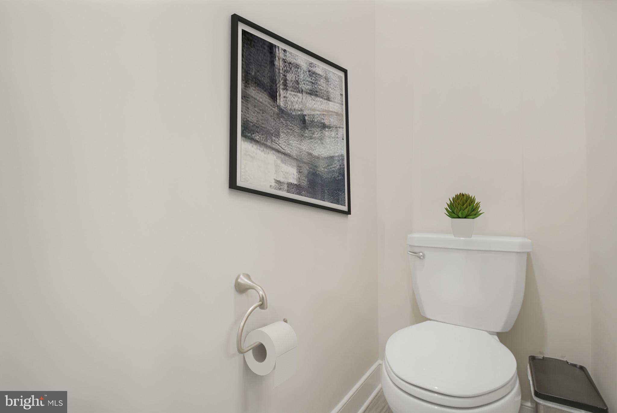 15535 Smoke Woodbridge, VA 22191 - Photo 32 of 44 a white toilet sitting next to a bathroom sink