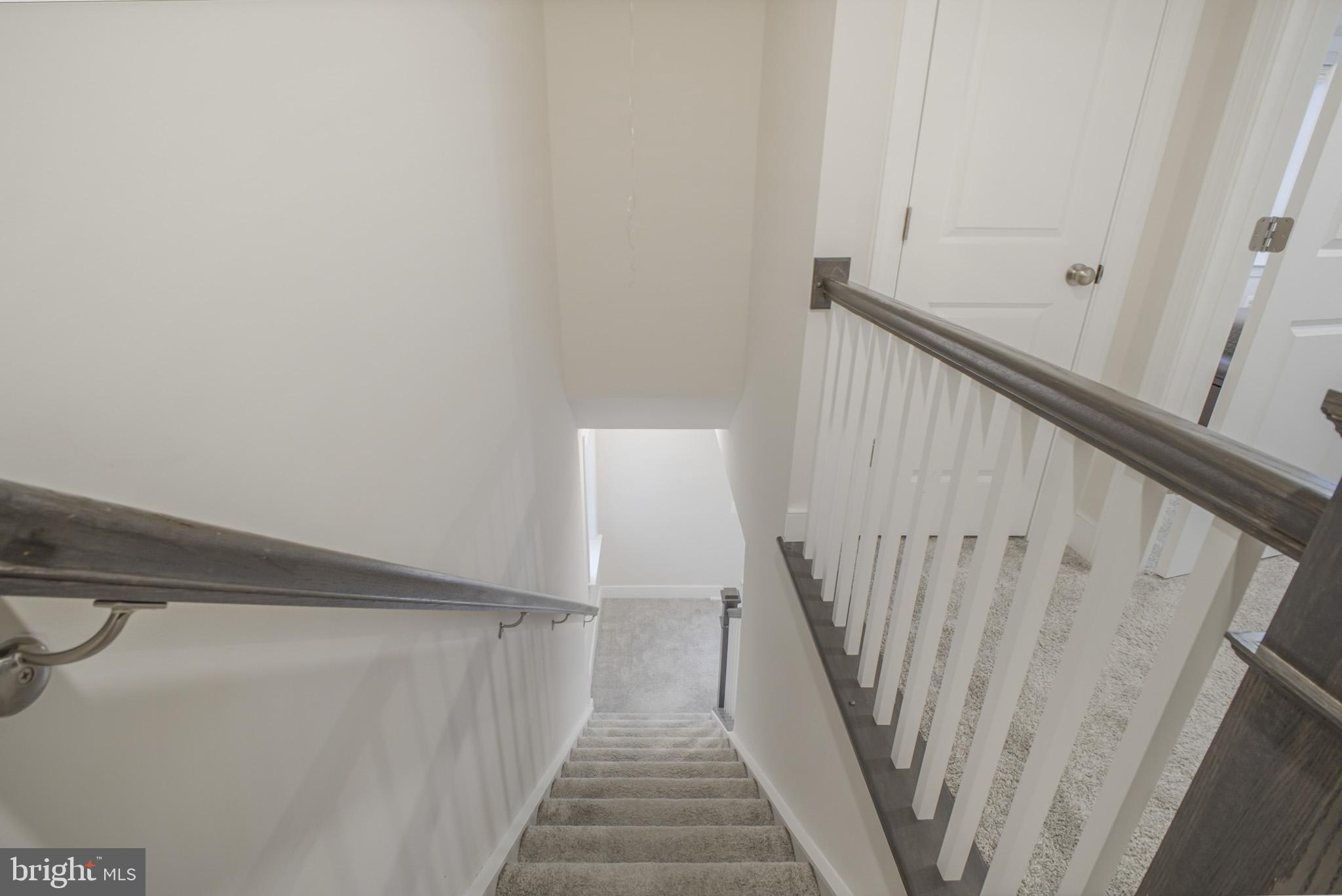 15535 Smoke Woodbridge, VA 22191 - Photo 34 of 44 a view of staircase with wooden floor and white walls