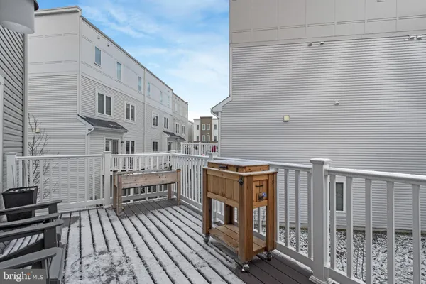 a view of a house with a wooden fence