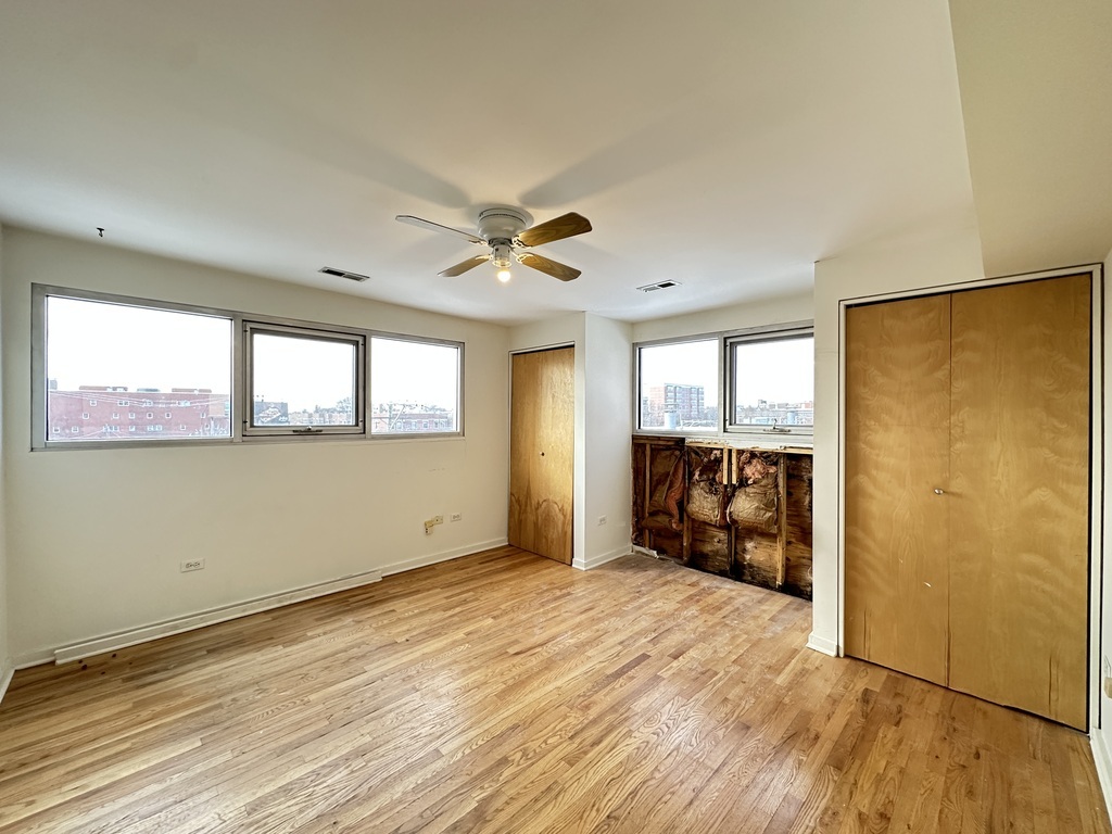 933 West Irving Park Road, Unit C Chicago, IL 60613 - Photo 17 of 20 a view of an empty room with a window