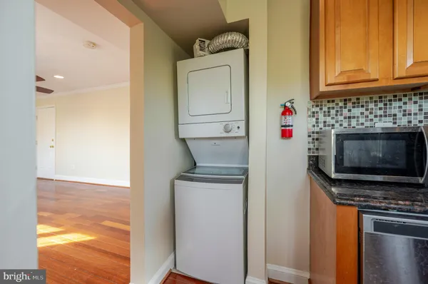 a kitchen with stainless steel appliances a stove and a microwave