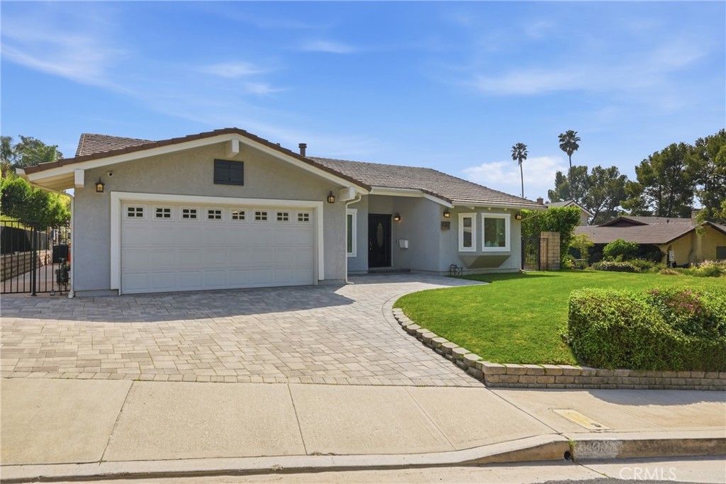 3240 Brace Canyon Road Burbank, CA 91504 - Photo 1 of 39 a front view of a house with a yard