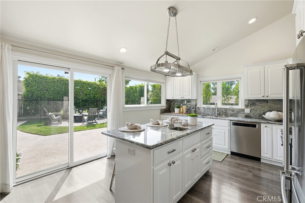 3240 Brace Canyon Road Burbank, CA 91504 - Photo 14 of 39 a kitchen with a stove sink and cabinets