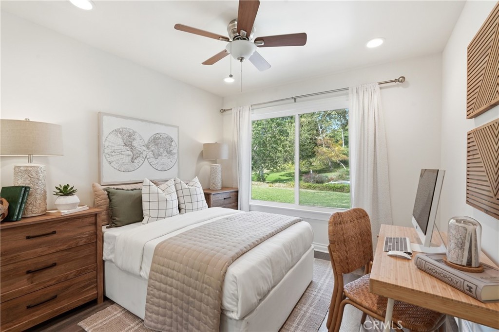 3240 Brace Canyon Road Burbank, CA 91504 - Photo 18 of 39 a bedroom with a bed a large window and chair