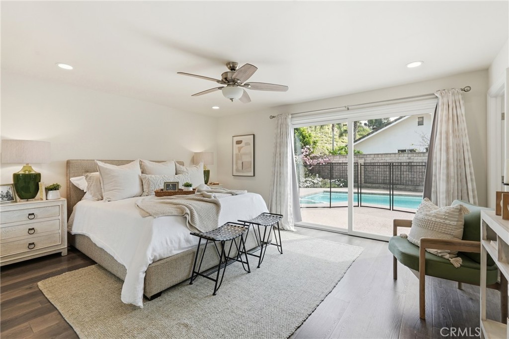3240 Brace Canyon Road Burbank, CA 91504 - Photo 21 of 39 a spacious bedroom with a bed and a large window