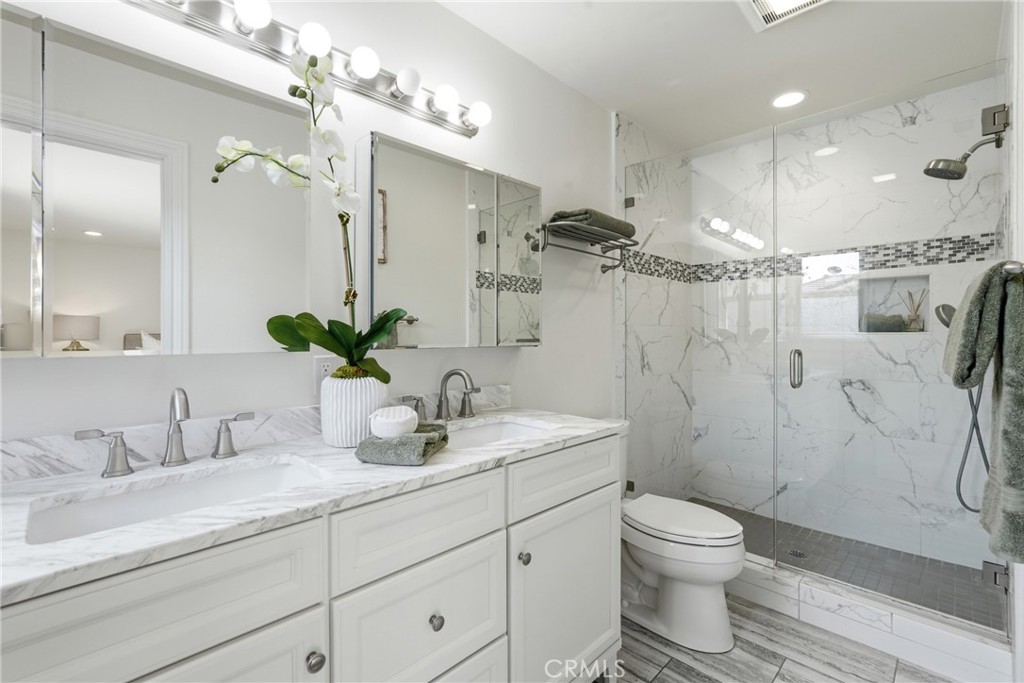 3240 Brace Canyon Road Burbank, CA 91504 - Photo 24 of 39 a bathroom with a sink a toilet and shower