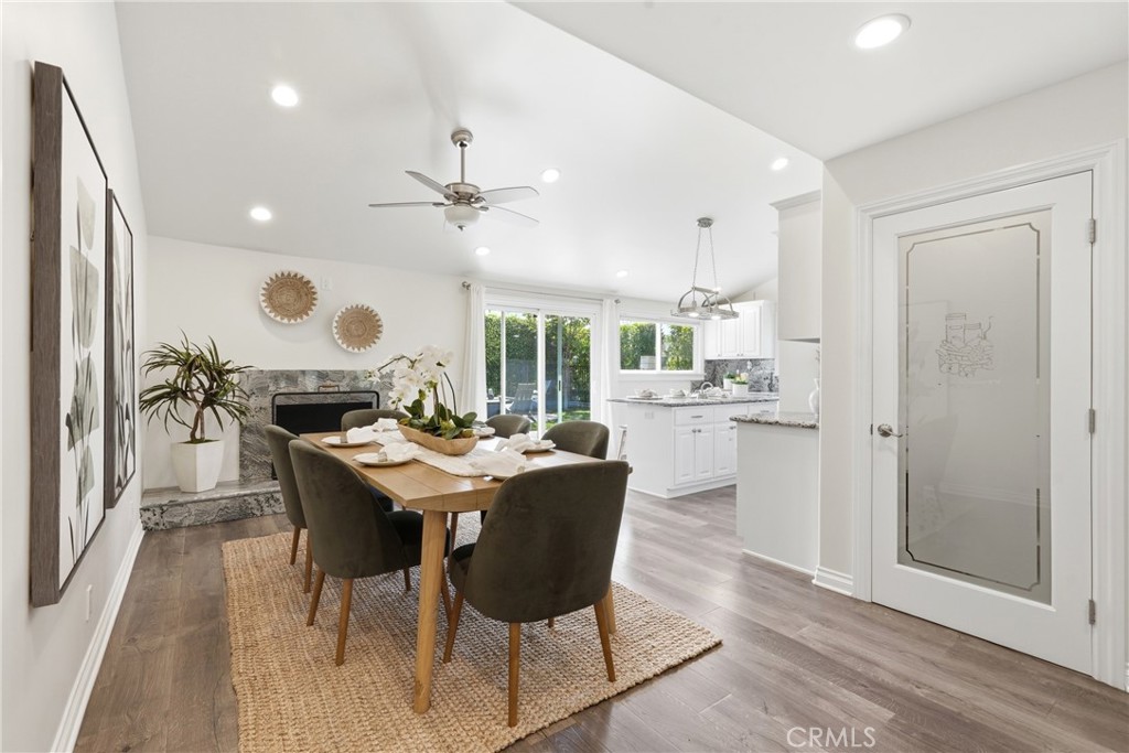 3240 Brace Canyon Road Burbank, CA 91504 - Photo 7 of 39 a view of a dining room with furniture and wooden floor