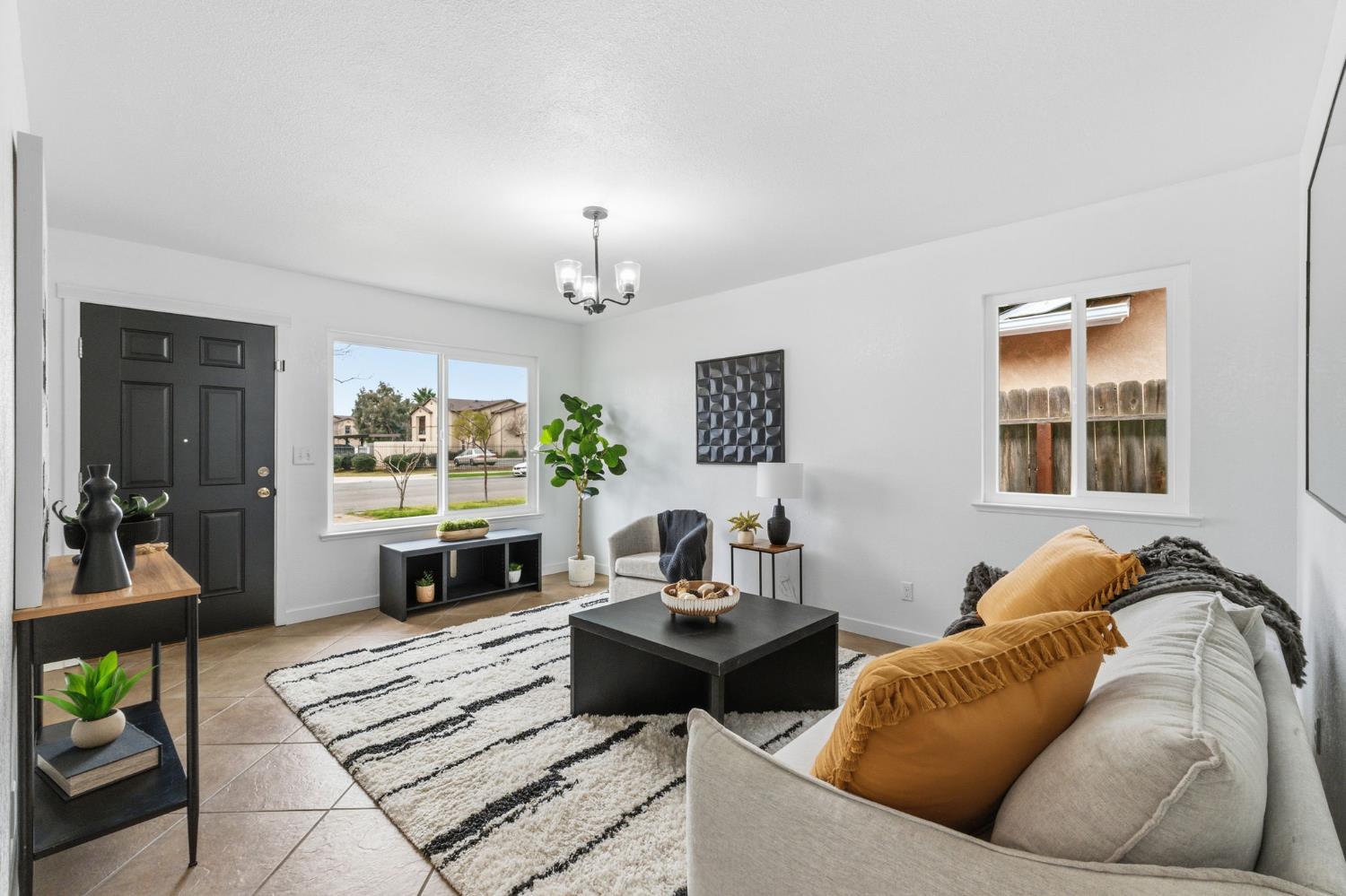1601 Sonora Street Madera, CA 93638 - Photo 8 of 47 a living room with furniture and a fireplace