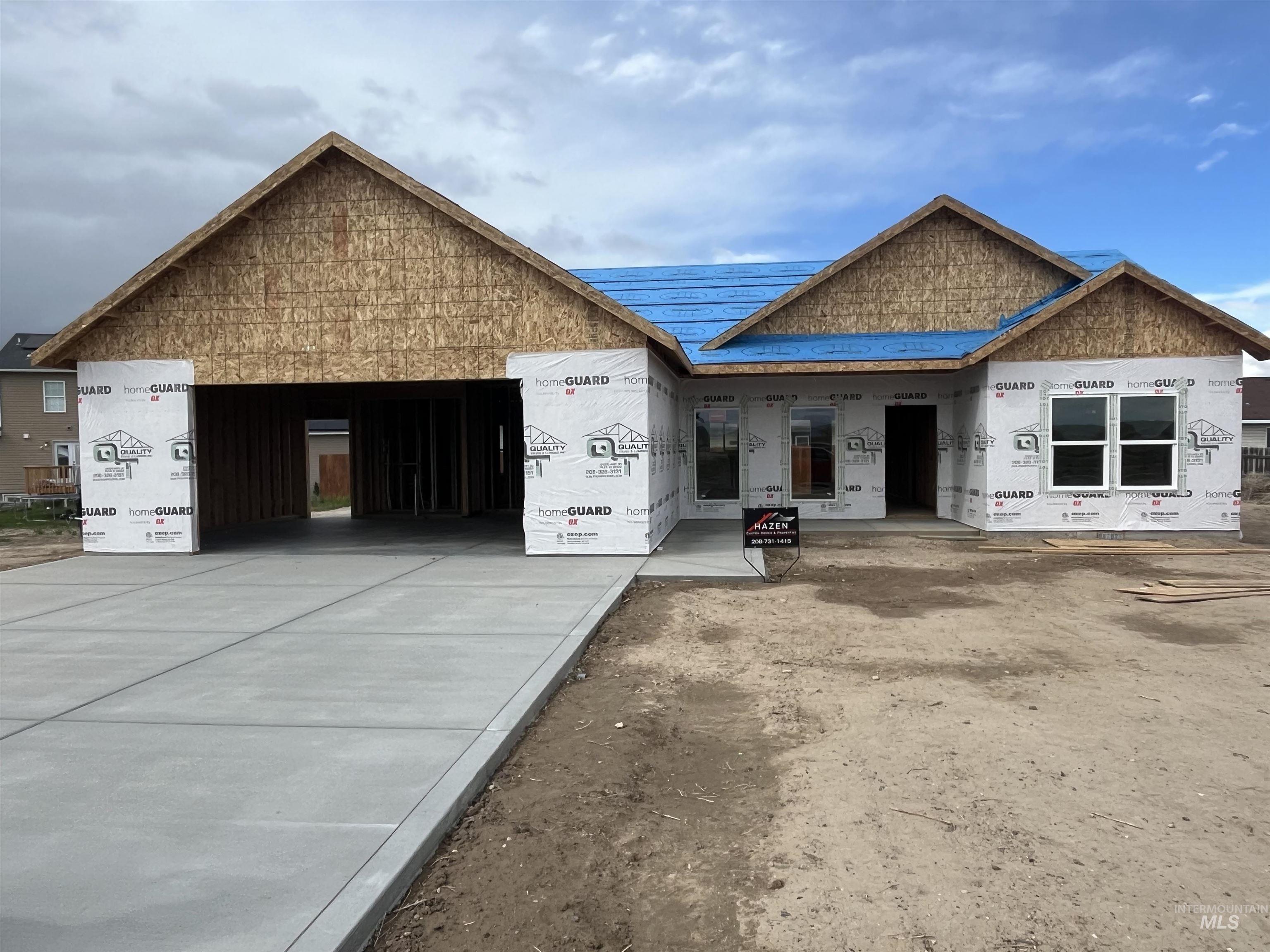 Tbd Locust Street Hazelton, ID 83335 - Photo 2 of 11 Property in mid-construction featuring an attached garage and concrete driveway
